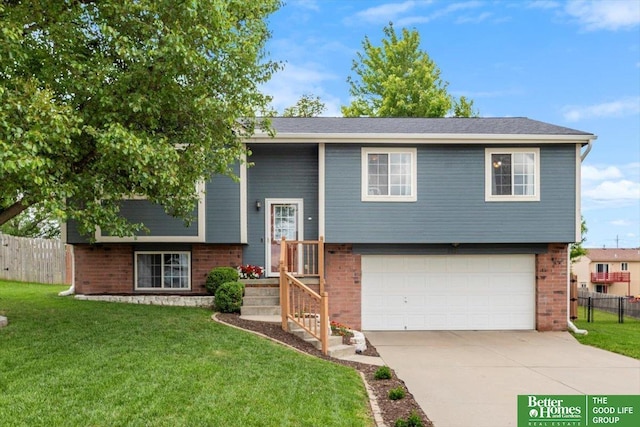 3221 Chad Ave, Bellevue, NE 68132 - bi-level home featuring a garage, brick siding, and concrete driveway