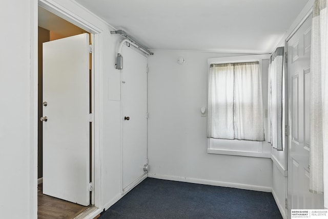 3847 Valley St, Omaha, NE 68105 - empty room with baseboards and dark colored carpet