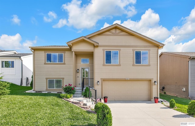 16421 Redman Ave, Omaha, NE 68116 - view of front facade with a garage, driveway, and a front lawn