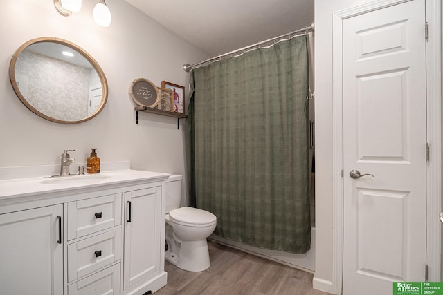 601 5th Ave, Plattsmouth, NE 68048 - full bath with toilet, wood finished floors, and vanity