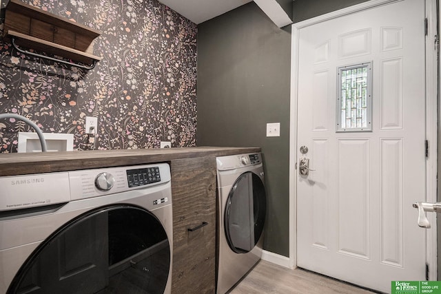 601 5th Ave, Plattsmouth, NE 68048 - laundry area with separate washer and dryer, wallpapered walls, light wood-style flooring, and baseboards