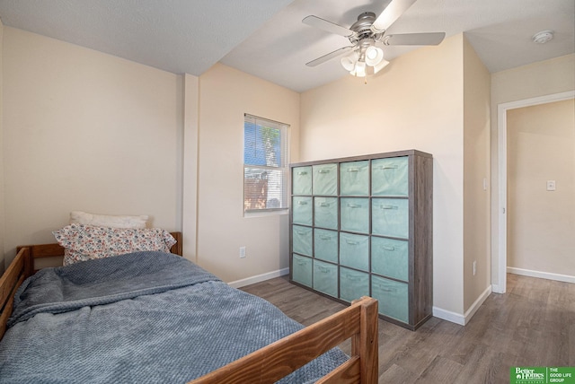 601 5th Ave, Plattsmouth, NE 68048 - bedroom featuring wood finished floors, baseboards, and a ceiling fan