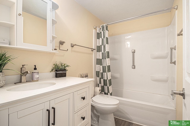 601 5th Ave, Plattsmouth, NE 68048 - full bathroom featuring vanity, shower / bath combo with shower curtain, toilet, wood finished floors, and a textured ceiling