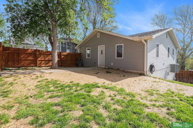601 5th Ave, Plattsmouth, NE 68048 - rear view of house featuring a fenced backyard and cooling unit