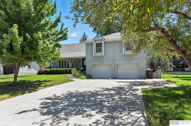 3629 S 114th Ave, Omaha, NE 68144 - tri-level home with a front lawn, concrete driveway, and brick siding