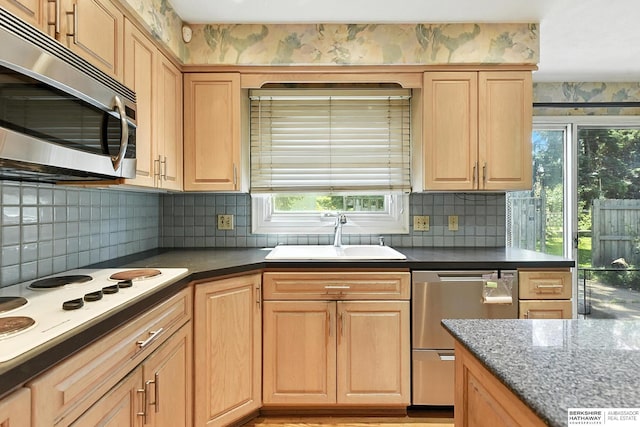 3629 S 114th Ave, Omaha, NE 68144 - kitchen featuring stainless steel appliances, healthy amount of natural light, backsplash, and light brown cabinetry