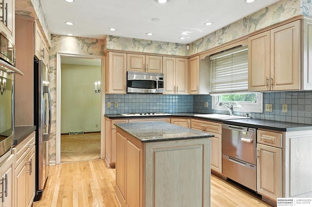 3629 S 114th Ave, Omaha, NE 68144 - kitchen with appliances with stainless steel finishes, light brown cabinets, a center island, light wood-style flooring, and recessed lighting