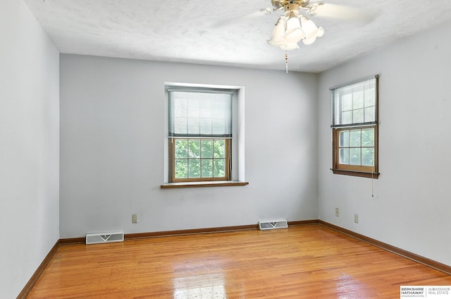 3629 S 114th Ave, Omaha, NE 68144 - unfurnished room featuring light wood-style floors and ceiling fan