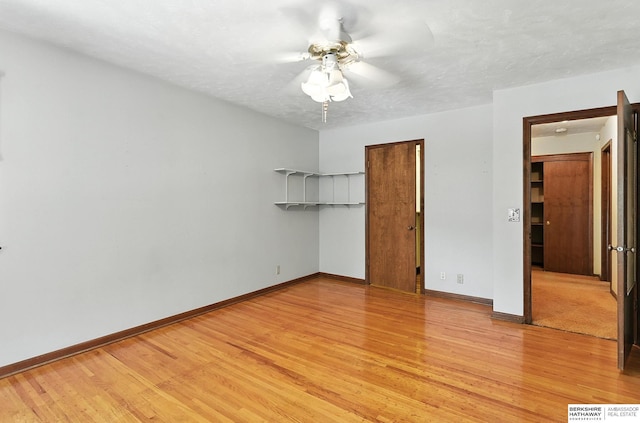 3629 S 114th Ave, Omaha, NE 68144 - unfurnished bedroom with light wood-style flooring, a closet, and a ceiling fan