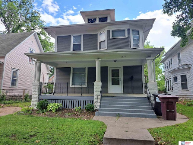 1519 Washington St, Lincoln, NE 68502 - american foursquare style home featuring covered porch