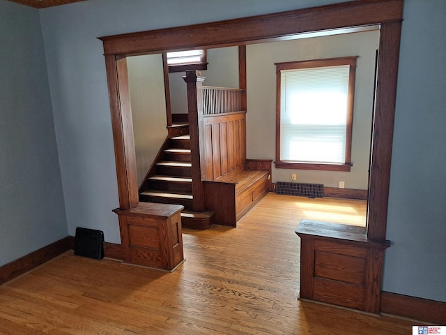 1519 Washington St, Lincoln, NE 68502 - unfurnished living room with wood finished floors and stairway