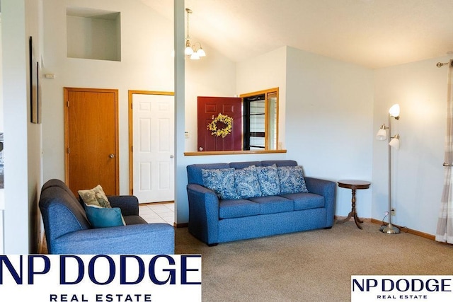 611 Diamond Ln, Papillion, NE 68133 - carpeted living room with a chandelier and a high ceiling