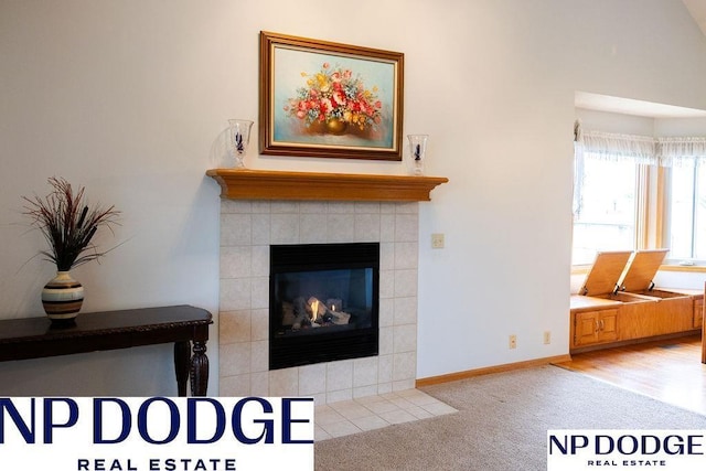 611 Diamond Ln, Papillion, NE 68133 - detailed view of a fireplace, carpet flooring, and baseboards