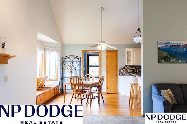 611 Diamond Ln, Papillion, NE 68133 - dining area featuring ceiling fan, high vaulted ceiling, and light wood-style floors