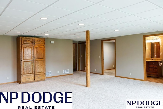 611 Diamond Ln, Papillion, NE 68133 - finished basement featuring a sink, light colored carpet, baseboards, and recessed lighting