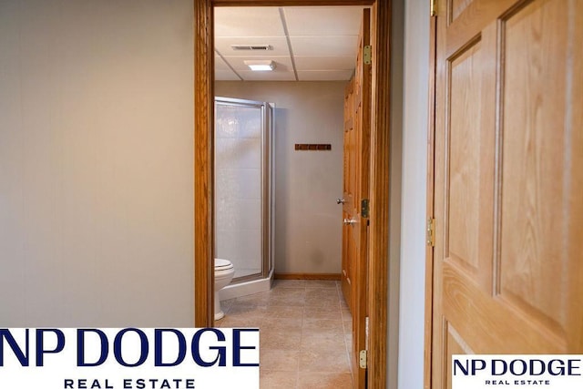 611 Diamond Ln, Papillion, NE 68133 - corridor featuring a drop ceiling, tile patterned floors, and baseboards