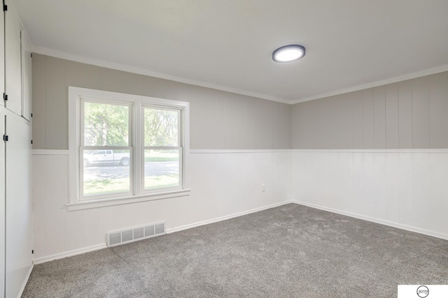 1801 Elk St, Beatrice, NE 68310 - carpeted empty room featuring ornamental molding and baseboards