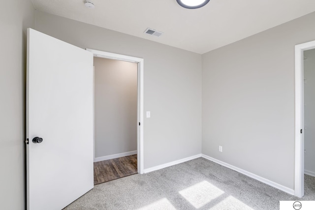 1801 Elk St, Beatrice, NE 68310 - unfurnished bedroom with carpet flooring and baseboards
