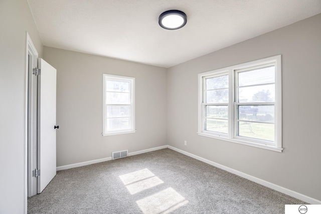 1801 Elk St, Beatrice, NE 68310 - unfurnished bedroom featuring carpet flooring and baseboards