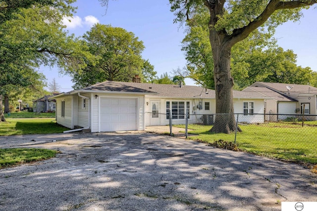 1801 Elk St, Beatrice, NE 68310 - single story home with asphalt driveway, a chimney, and a garage