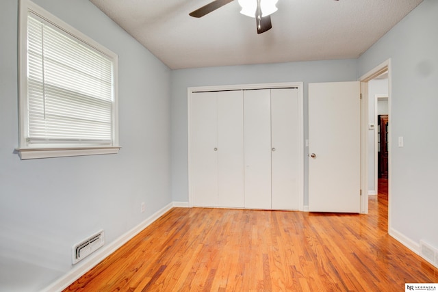 6205 Nebraska Ave, Omaha, NE 68104 - unfurnished bedroom with light wood finished floors, a closet, baseboards, and ceiling fan