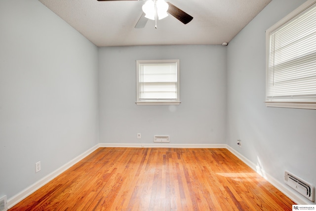 6205 Nebraska Ave, Omaha, NE 68104 - spare room featuring ceiling fan, light wood finished floors, baseboards, and a baseboard radiator