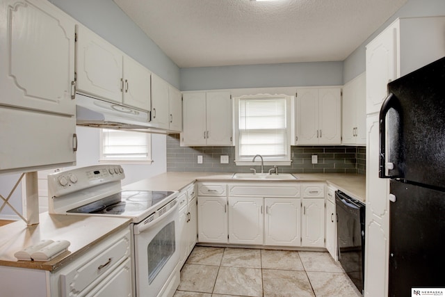 6205 Nebraska Ave, Omaha, NE 68104 - kitchen featuring black appliances, a sink, plenty of natural light, tasteful backsplash, and a textured ceiling