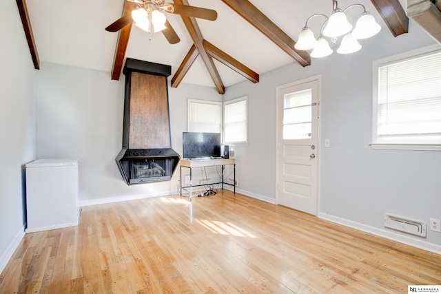 6205 Nebraska Ave, Omaha, NE 68104 - living room with a chandelier, ceiling fan, wood finished floors, and baseboards