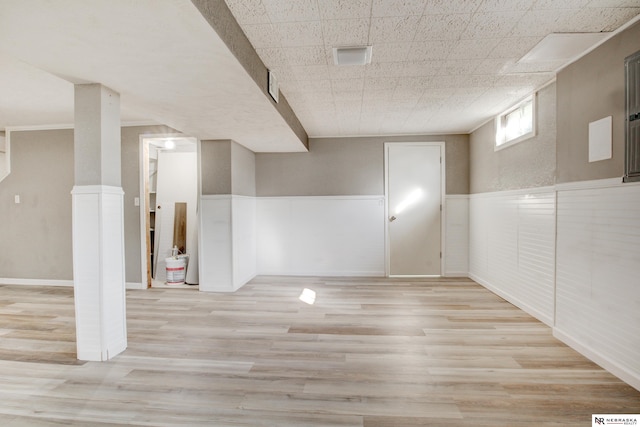 6205 Nebraska Ave, Omaha, NE 68104 - below grade area with a wainscoted wall and light wood finished floors