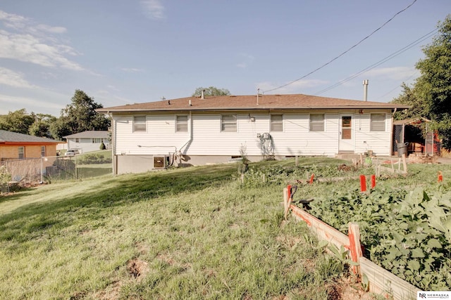 6205 Nebraska Ave, Omaha, NE 68104 - back of house featuring a vegetable garden