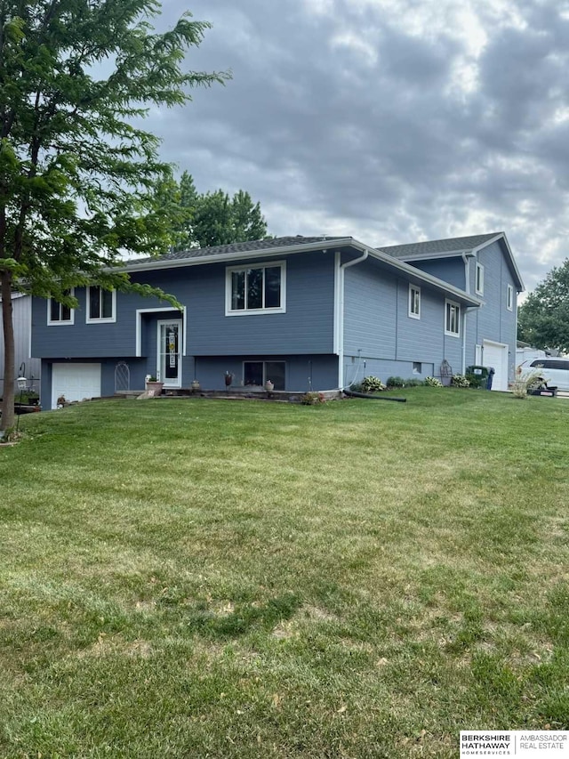 55 Hawthorne Dr, Yutan, NE 68073 - view of front of property featuring a garage and a front lawn