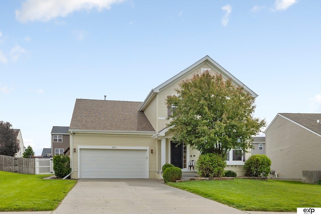 8815 N Hws Cleveland Blvd, Bennington, NE 68007 - view of front of property featuring concrete driveway, an attached garage, and a shingled roof