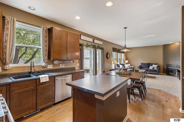 8815 N Hws Cleveland Blvd, Bennington, NE 68007 - kitchen featuring stainless steel dishwasher, dark countertops, a sink, healthy amount of natural light, and recessed lighting