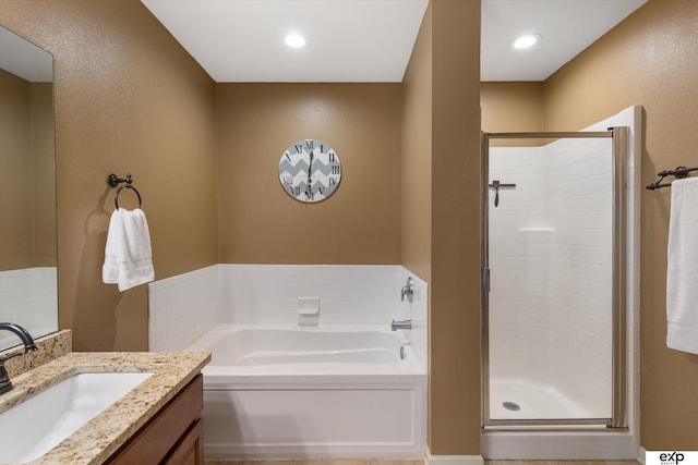 8815 N Hws Cleveland Blvd, Bennington, NE 68007 - bathroom with vanity, a garden tub, and a stall shower