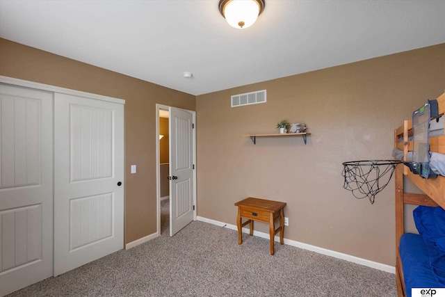 8815 N Hws Cleveland Blvd, Bennington, NE 68007 - bedroom featuring carpet floors, a closet, and baseboards