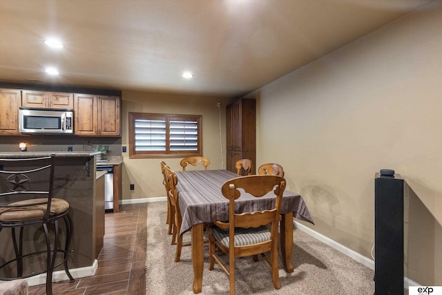 8815 N Hws Cleveland Blvd, Bennington, NE 68007 - dining room featuring recessed lighting, baseboards, and dark wood-style flooring