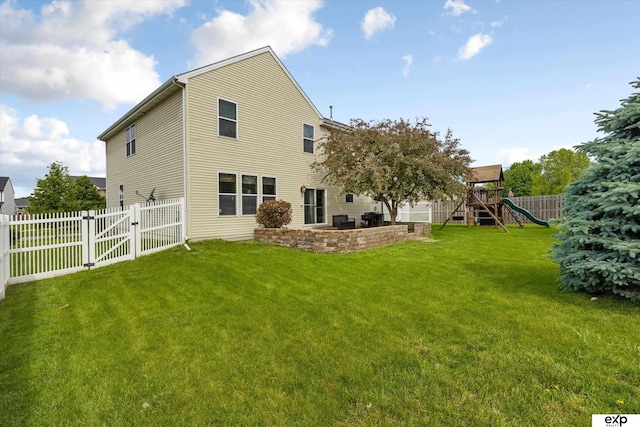 8815 N Hws Cleveland Blvd, Bennington, NE 68007 - rear view of house with a patio, a playground, and a gate