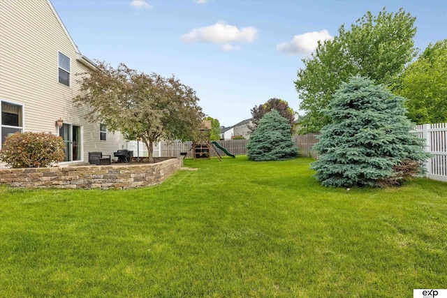 8815 N Hws Cleveland Blvd, Bennington, NE 68007 - view of yard with a playground and a patio area