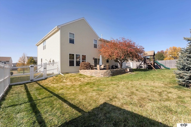 8815 N Hws Cleveland Blvd, Bennington, NE 68007 - back of property featuring a playground, a gate, a fenced backyard, and a patio