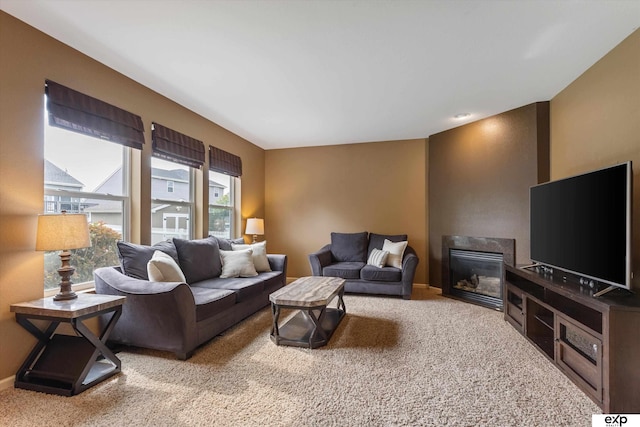 8815 N Hws Cleveland Blvd, Bennington, NE 68007 - carpeted living room with a glass covered fireplace and baseboards