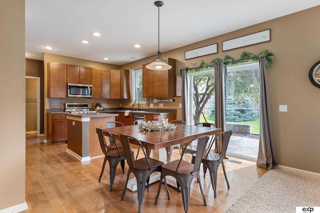 8815 N Hws Cleveland Blvd, Bennington, NE 68007 - dining space with light wood-style floors, baseboards, and recessed lighting