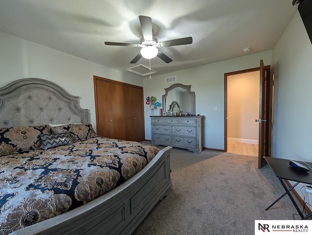 2496 Rock Creek Rd, Bee, NE 68314 - carpeted bedroom featuring a closet, baseboards, a ceiling fan, and attic access