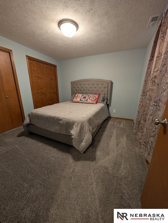 2496 Rock Creek Rd, Bee, NE 68314 - bedroom with carpet flooring and a textured ceiling
