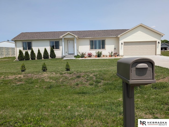 2496 Rock Creek Rd, Bee, NE 68314 - ranch-style house with concrete driveway, a garage, and a front yard