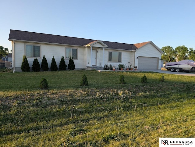2496 Rock Creek Rd, Bee, NE 68314 - ranch-style home featuring concrete driveway, a garage, a front yard, and cooling unit