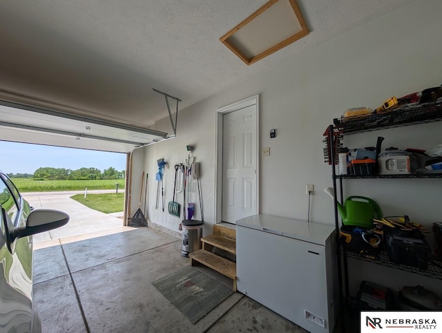 2496 Rock Creek Rd, Bee, NE 68314 - garage with white fridge