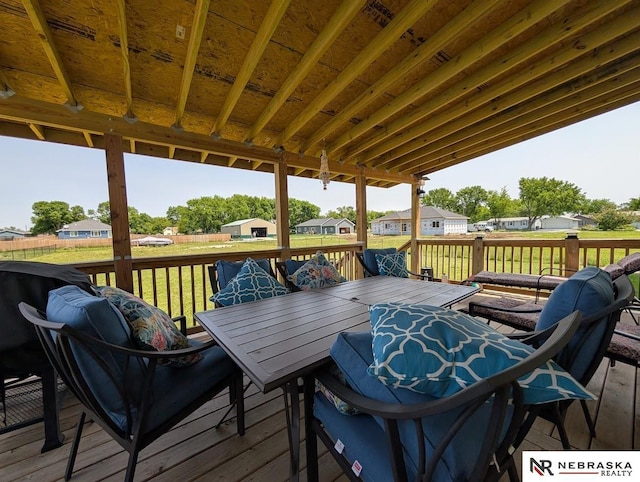 2496 Rock Creek Rd, Bee, NE 68314 - wooden deck with outdoor dining space, a residential view, and a lawn