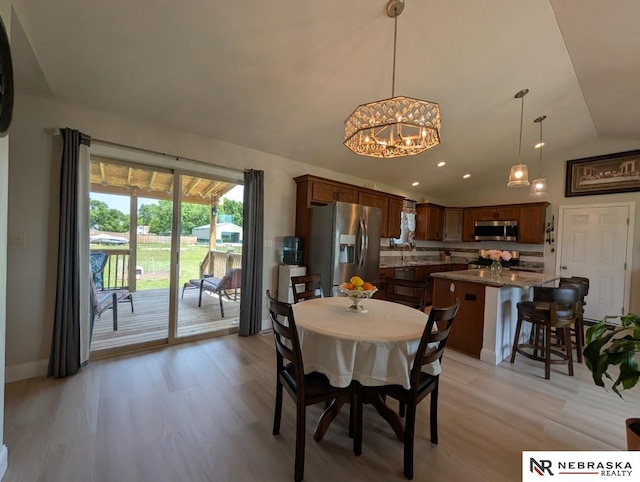 2496 Rock Creek Rd, Bee, NE 68314 - dining area with lofted ceiling, a chandelier, light wood-style floors, baseboards, and recessed lighting