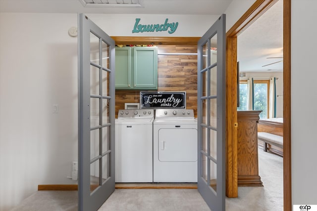 17205 Jessica Ln, Gretna, NE 68028 - washroom featuring cabinet space, french doors, light colored carpet, and washing machine and dryer