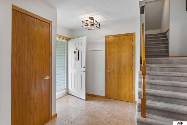 17205 Jessica Ln, Gretna, NE 68028 - foyer with stairs and light tile patterned flooring